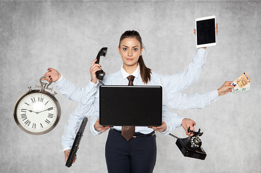 Image of office staff member multitasking